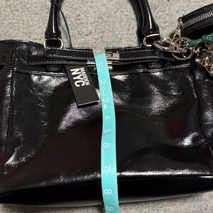 Black Leather Tote with Red Pom Charm